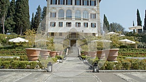 Exterior of fancy Italian hotel with garden