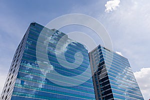 Exterior glass office building with sky and cloud