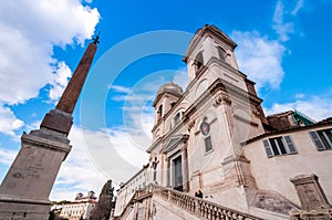 The exterior of the Holy Trinity Church of the Mountains and the obelisk in Rome in Lazio, Italy