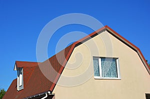 Exterior House Attic Dormer Window and Roofing Construction.