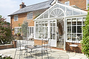 Exterior Of House With Conservatory And Patio