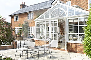 Exterior Of House With Conservatory And Patio