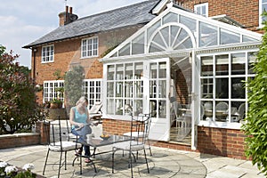 Exterior Of House With Conservatory And Patio