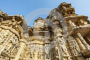 Exterior of the Jain temple Adinatha temple with scenes from the Kamasutra, in Ranakpur, Rajasthan, India photo