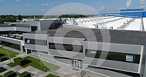 The exterior of a large modern production plant or factory, industrial exterior, modern production exterior