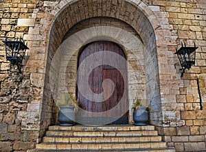 Exterior of Large Old Wooden Arched Door in Spain