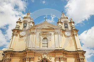 Exterior of Mdina Cathedral church with blue sky in Malta