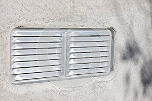 Exterior metal air vent on wall