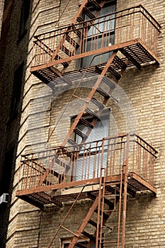 exterior metal fire escapes on apartment building, Greenwich Village