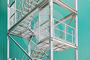 Exterior metal staircase with handrails at a industrial building
