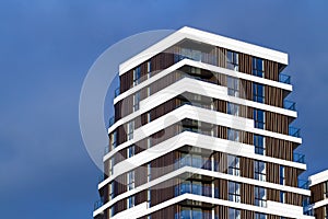 Exterior of modern apartment building - combination of glass, wood, concrete and metal