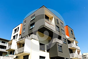 Exterior of a modern apartment buildings on blue sky backgrou photo