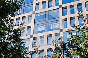 Exterior of modern architecture in the city center. Construction abstract background. Detail of the facade with windows.