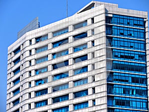 Exterior of A Modern Building with White Walls and Blue Glass Windows