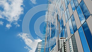 Exterior of Modern Glass Office Building in Urban City on Sunny Day. Blue Sky as background