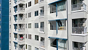 Exterior of a modern high-rise multi-story apartment building condo - facade, windows and balconies