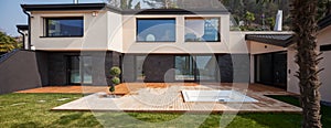 Exterior of a modern villa, veranda with bathtub