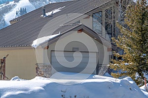 Exterior of mountain home in Park City Utah with attached garage and gable roof