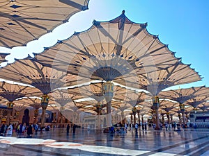 Exterior of Nabawi Mosque building and electronic umbrella in Medina