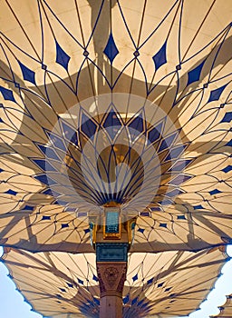 Exterior of Nabawi Mosque building and electronic umbrella in Medina