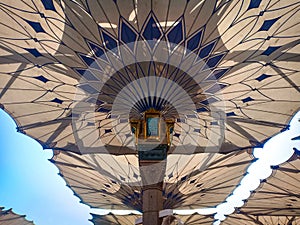 Exterior of Nabawi Mosque building and electronic umbrella in Medina
