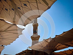 Exterior of Nabawi Mosque building and electronic umbrella in Medina