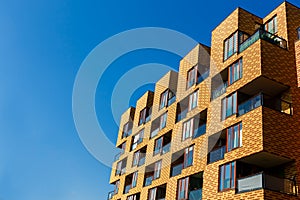 Exterior of new apartment buildings on a blue sky background.