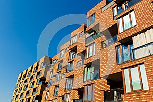 Exterior of new apartment buildings on a blue sky background.