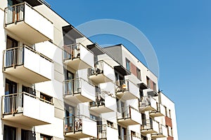 Exterior of new apartment buildings on a blue sky background. R