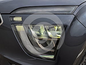 Exterior of a new car. Front LED low beam and high beam headlights