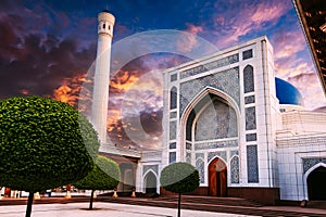 exterior of new white marble Islamic Minor Mosque in Tashkent in Uzbekistan on background of sunset sky in summer