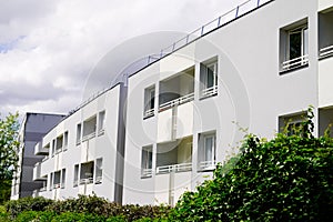 Exterior of new white modern architecture residential building in street
