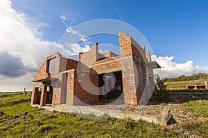 Exterior of an old building under construction. Orange brick walls in a new house.