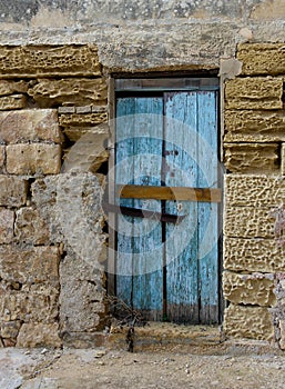 Exterior,Old door fragment, old door texture view, abstract scene, nobody at home, weathered door, close door in bright wall