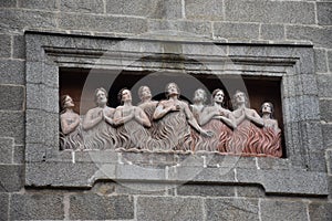 Exterior sculpture of souls in purgatory at Capela de Animas,