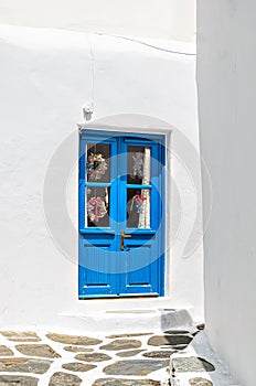 Exterior shot of a blue door, typical of a house on the island of Myconos, Cyclades, Greece