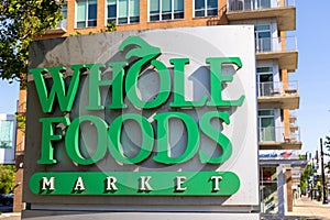 Exterior sign of the Whole foods market is an American multinational supermarket chain