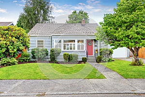 Exterior of small American house with blue paint