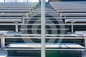 Exterior stadium bleacher stairs with a sun star near the top with clouds.