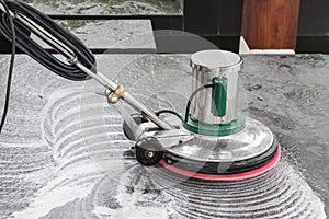 Exterior stone floor cleaning with polishing machine and chemica