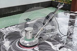 Exterior stone floor cleaning with polishing machine and chemica