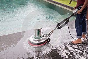 Exterior stone floor cleaning with polishing machine and chemica
