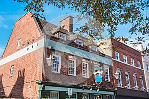 Exterior of traditional brick buildings on a sunny autumn day