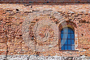 Exterior of the Trakai castle old brick wall with a window in Trakai, Lithuania.