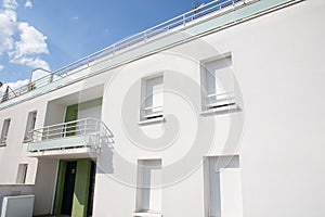 Exterior typical establishing building white facade during day time apartment condo