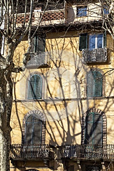 Exterior of typical Italian buildings in on Piazza Napoleone. Lucca, Tuscany, Italy