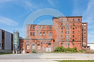 Exterior view of a decayed factory building made of brick
