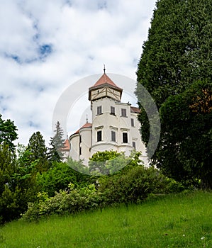 Exterior view of Konopiste Castle, former residence of Archduke Franz Ferdinand of Austria, surrounded by lush greenery and photo