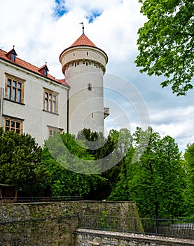 Exterior view of Konopiste Castle, former residence of Archduke Franz Ferdinand of Austria, surrounded by lush greenery and photo