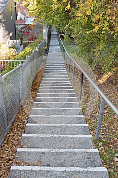 Large concrete steps moving up an incline between two streets photo